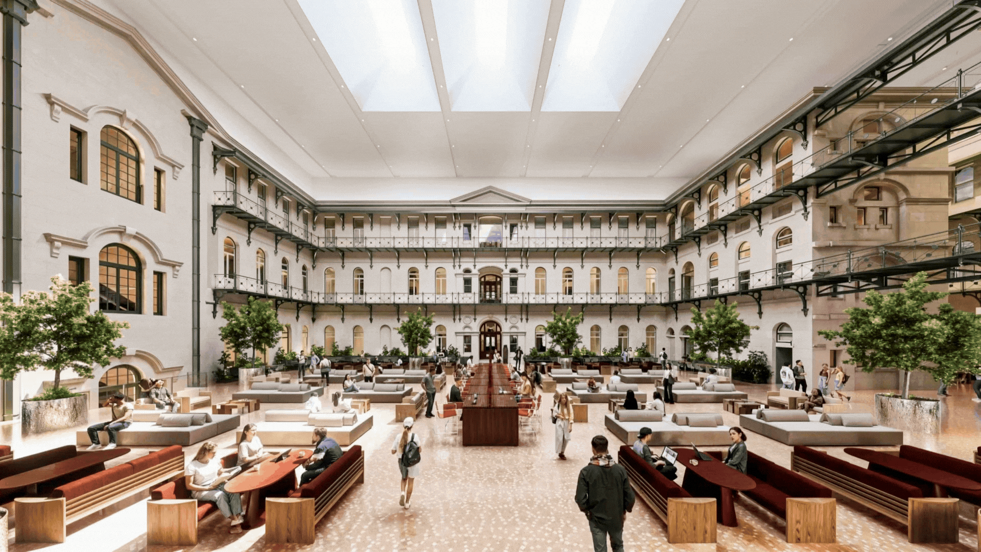 CGI multi‑level university atrium featuring arched windows, ornate railings, skylight ceiling, communal tables, lounge seating, and indoor trees. Designed to showcase a bright, collaborative academic environment within a heritage building.